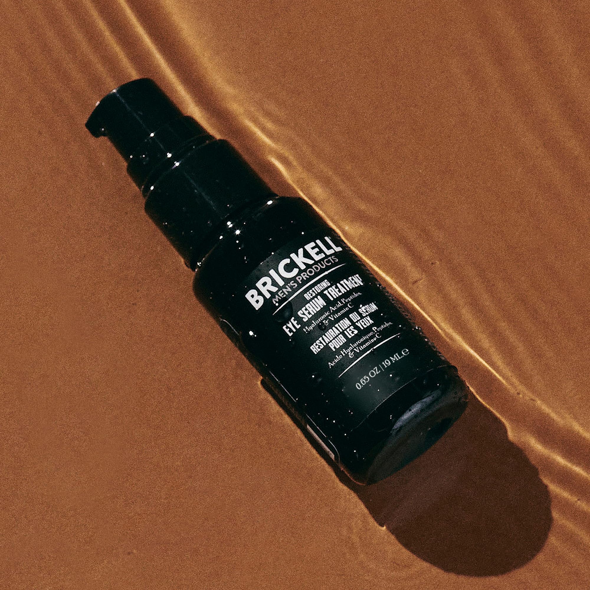 Brickell Men's Dark Circle Eye Serum unscented tube ready for gentle application.