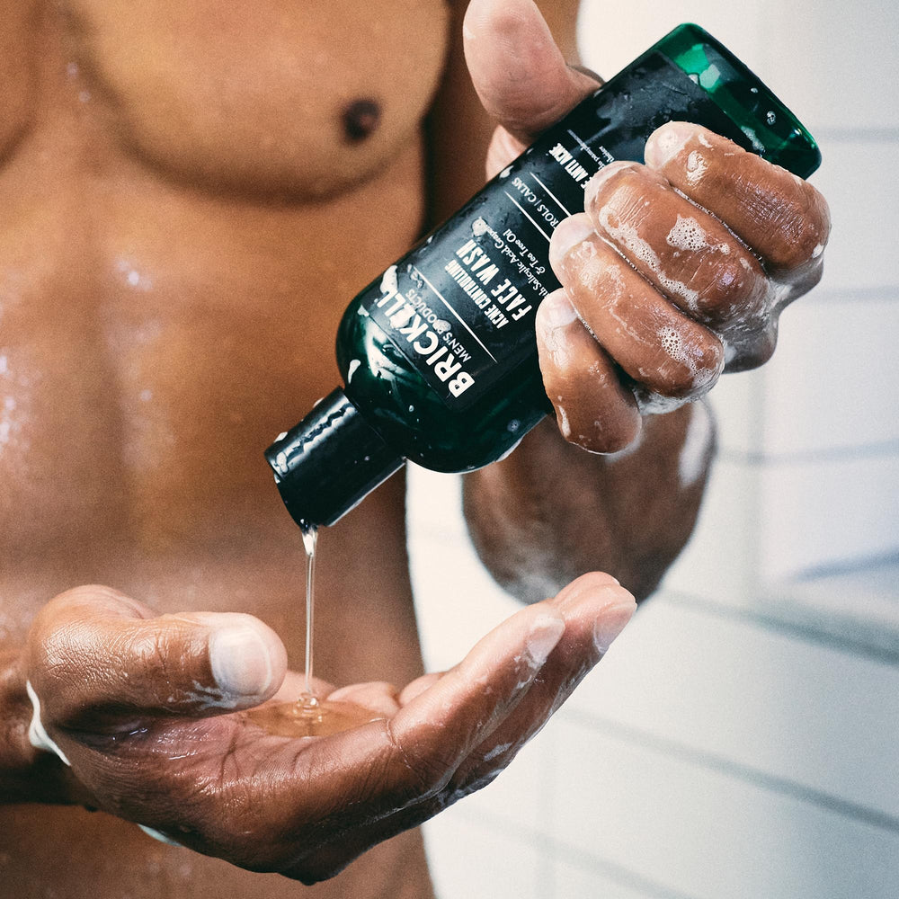 Brickell Men's Acne Face Wash bottle pour for easy blemish care.