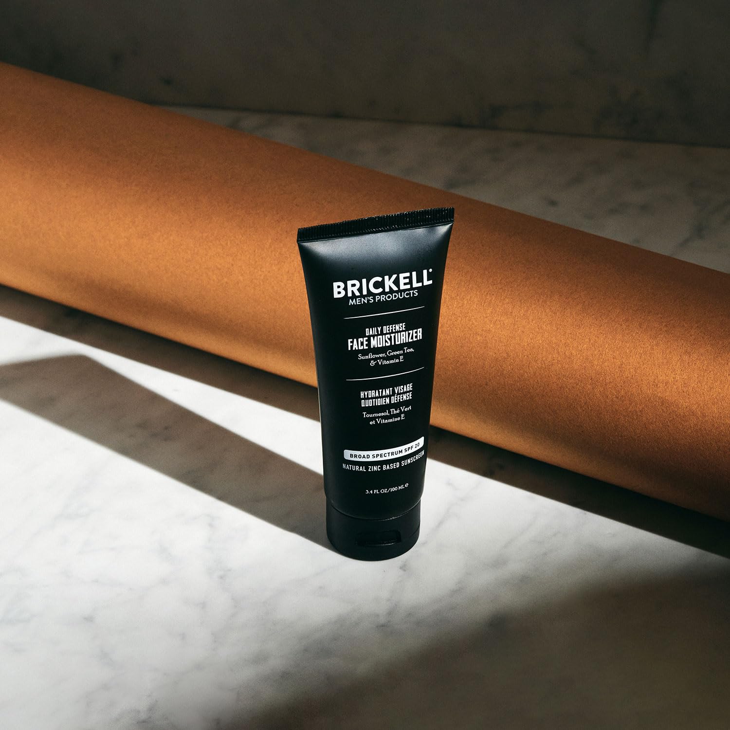 Brickell Men's Daily Defense SPF20 application image demonstrating even spread.