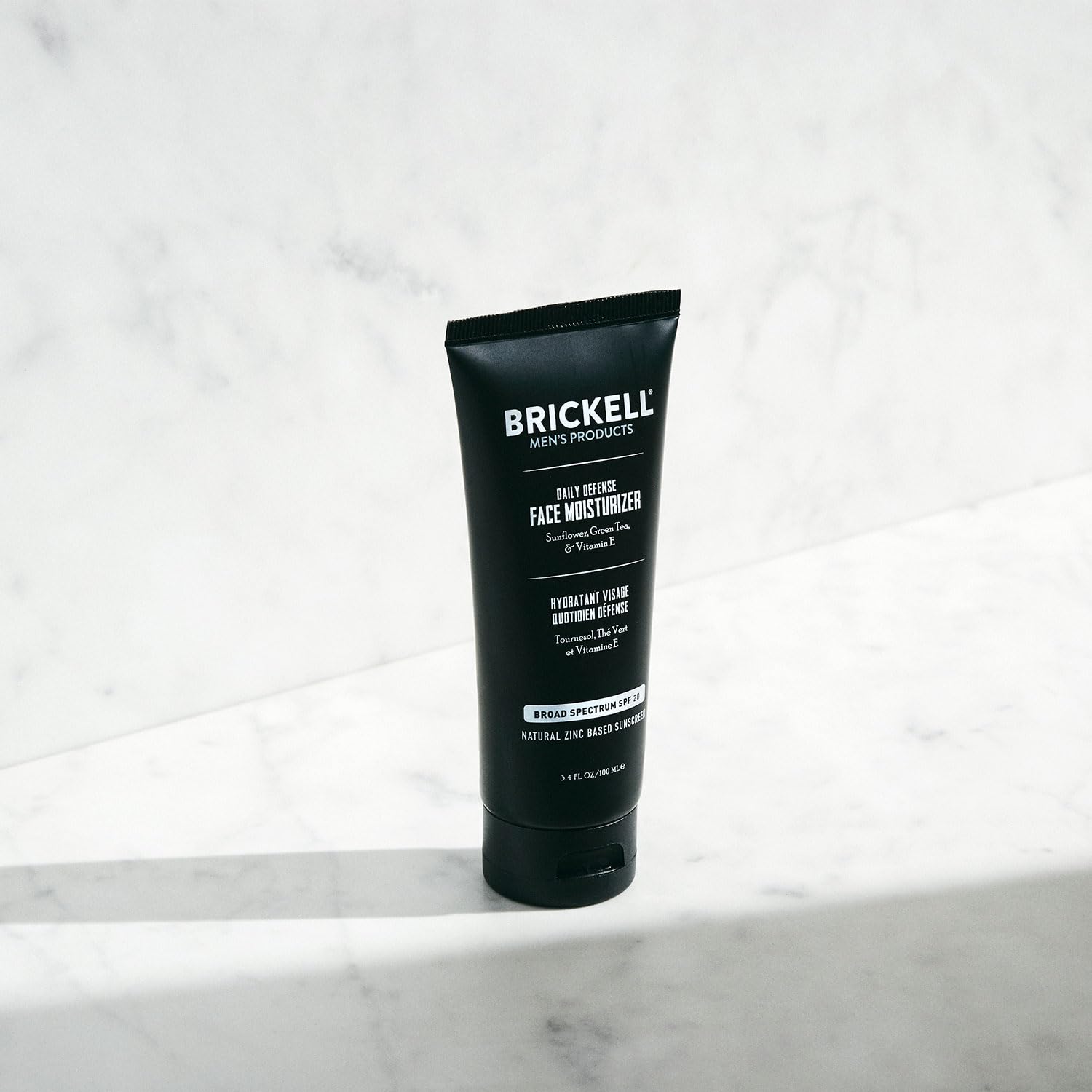 Brickell Men's Daily Defense SPF20 unscented formula close-up for sensitive skin.
