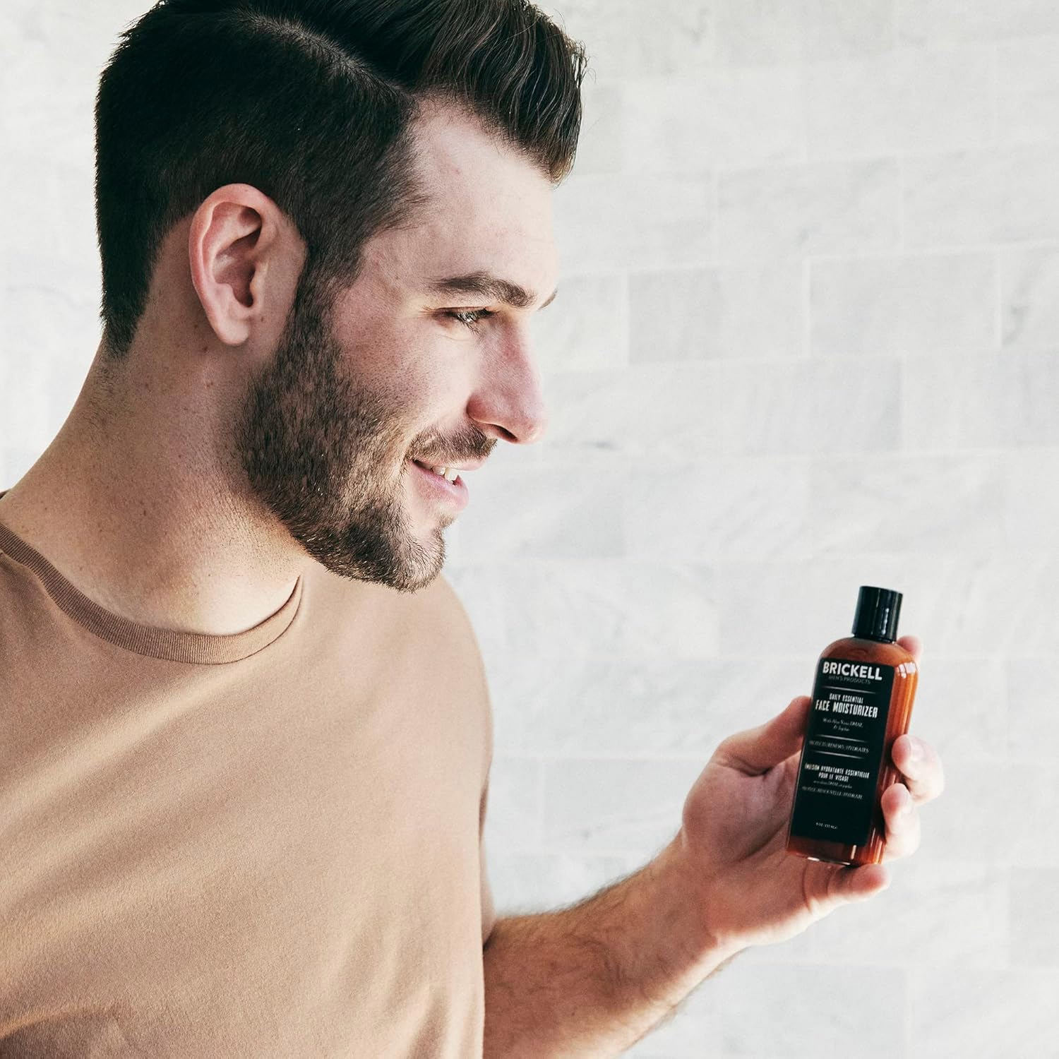 Brickell Men's Daily Essential Moisturizer packaging front highlights natural ingredients and unscented design.