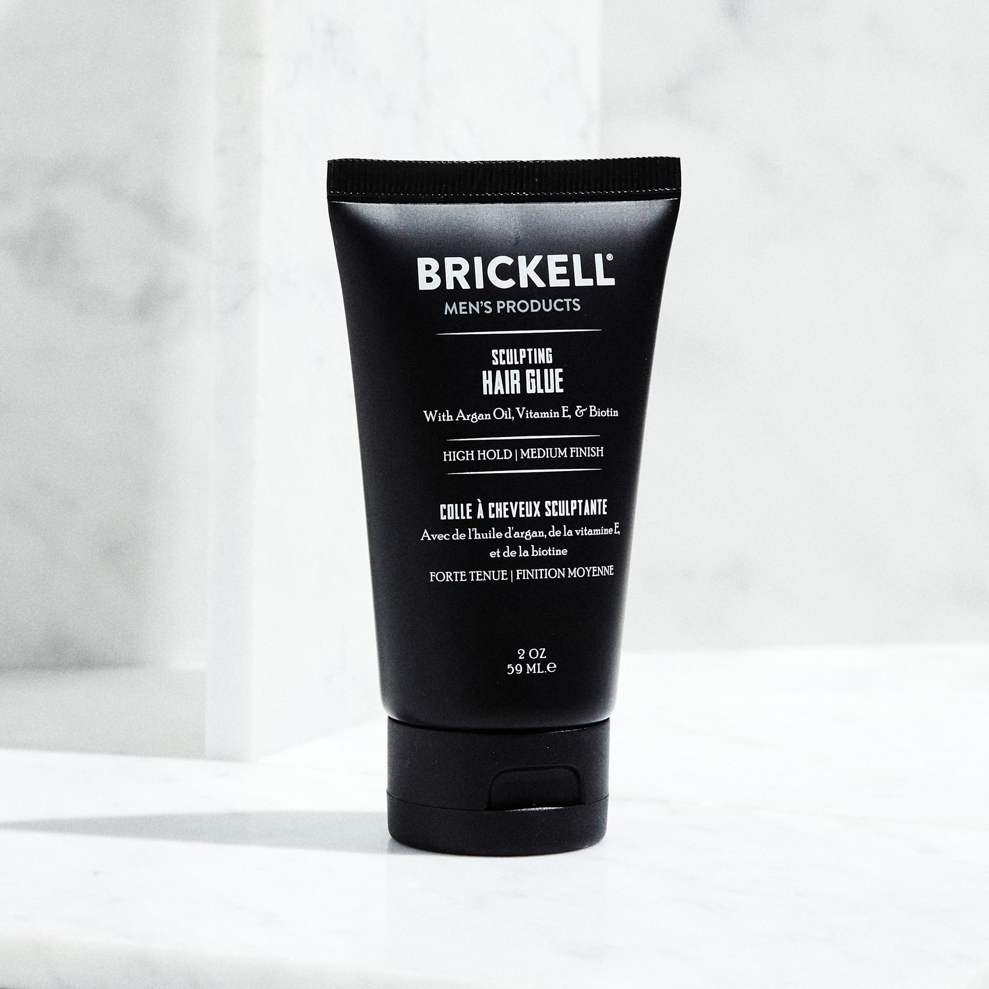 Brickell Men's Hair Glue vitamin E drop promotes hair protection.
