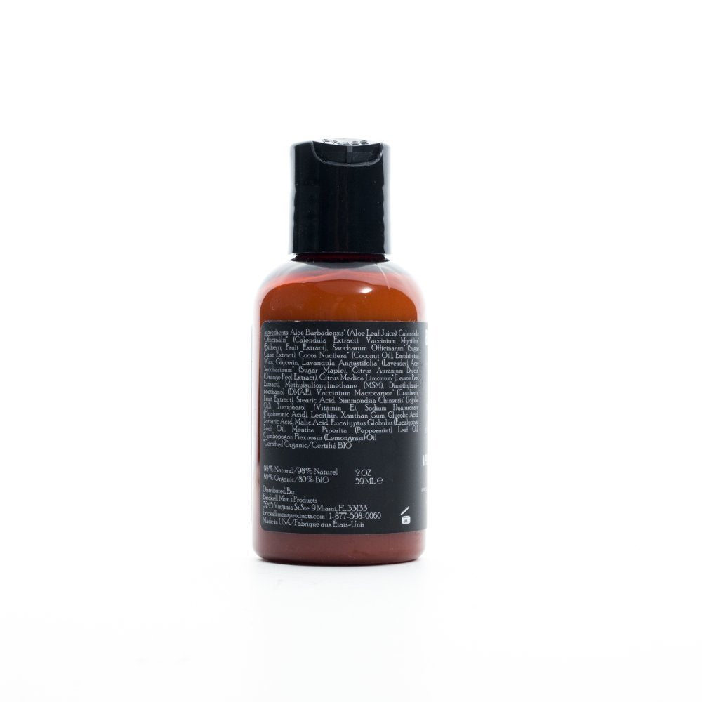Brickell balm being rubbed onto jawline after shave for protection and hydration.
