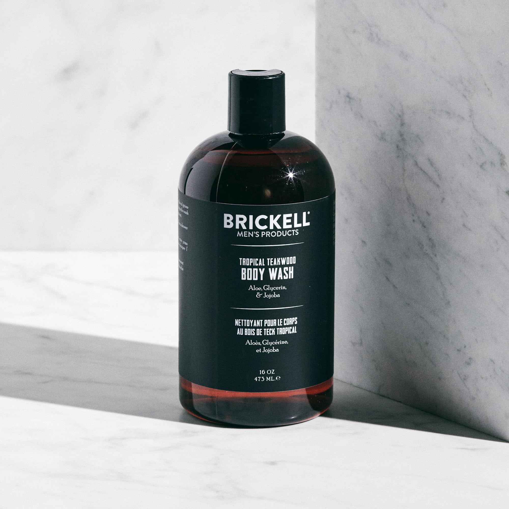 Brickell Men's Invigorating Body Wash lather shot demonstrates deep-cleaning foam.