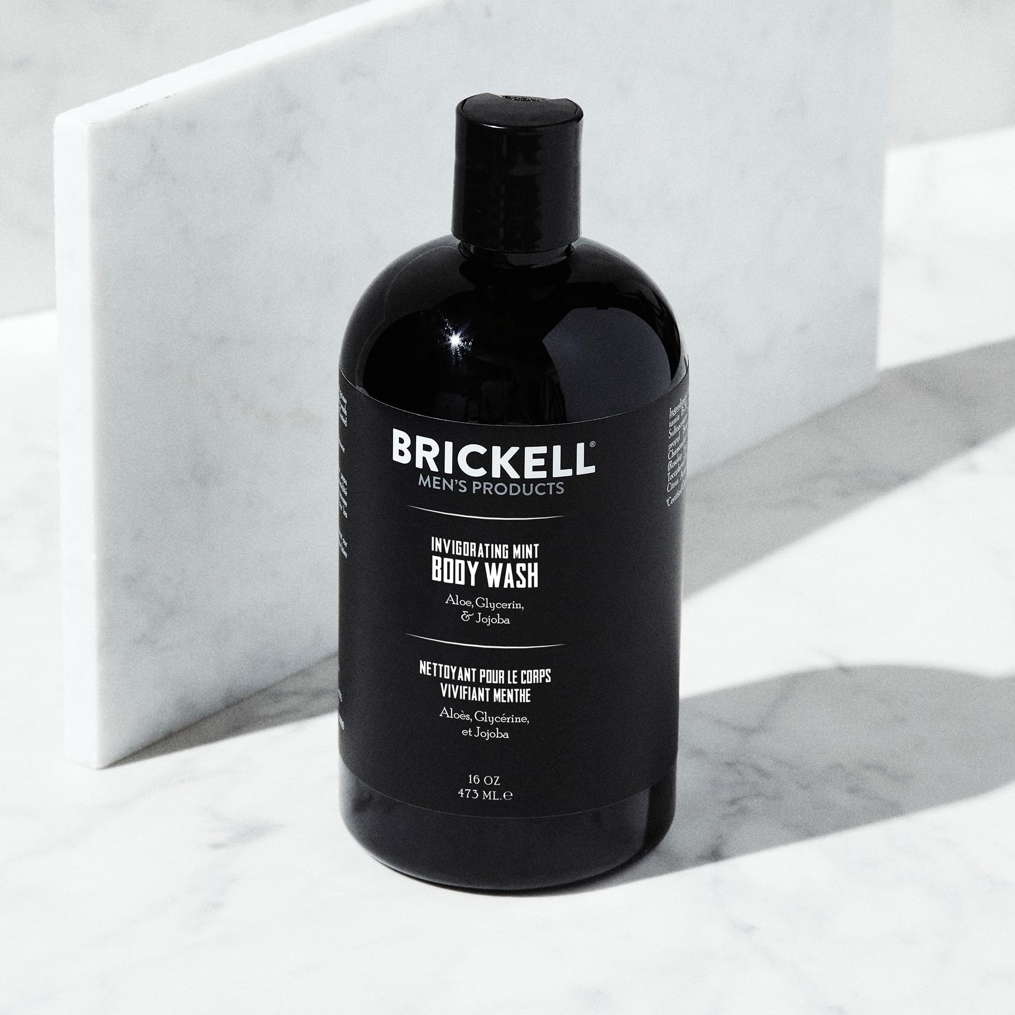 Brickell Men's Invigorating Mint Body Wash bottle pour – easy dispense for quick, refreshing showers.