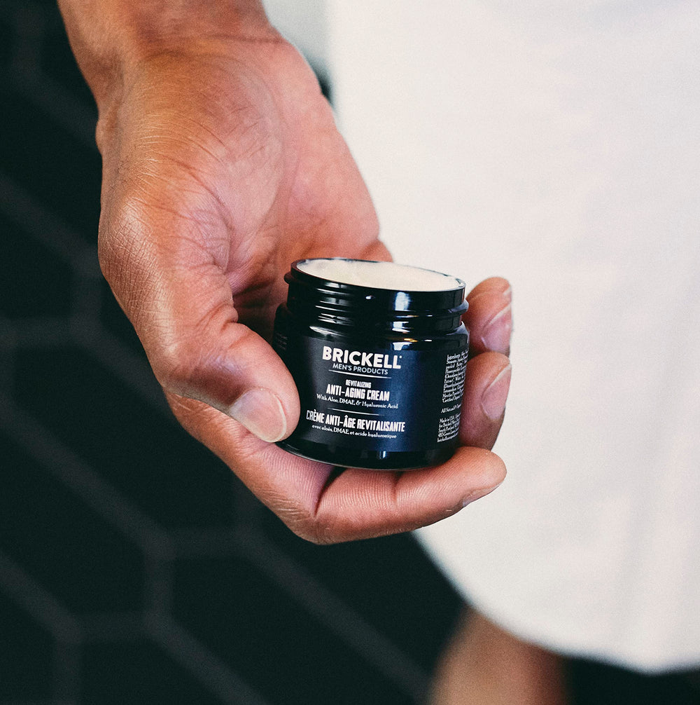 Brickell Men's Night Cream application shown for overnight nourishment and restoration.