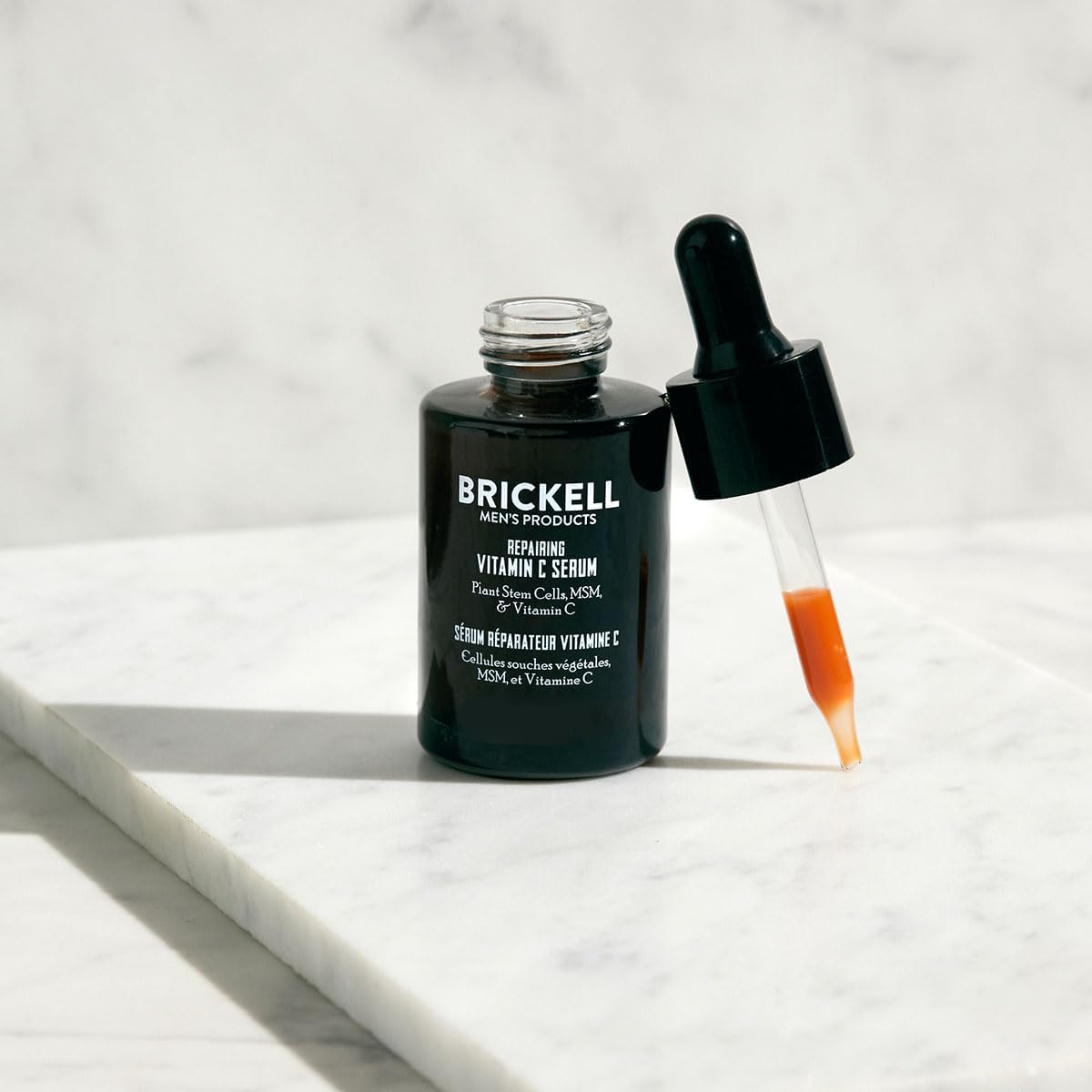 Brickell Men's night serum on skin during sleep for renewal.