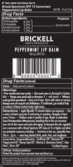 Brickell Men's No Shine Lip Balm SPF 15 on lips offers sun protection.