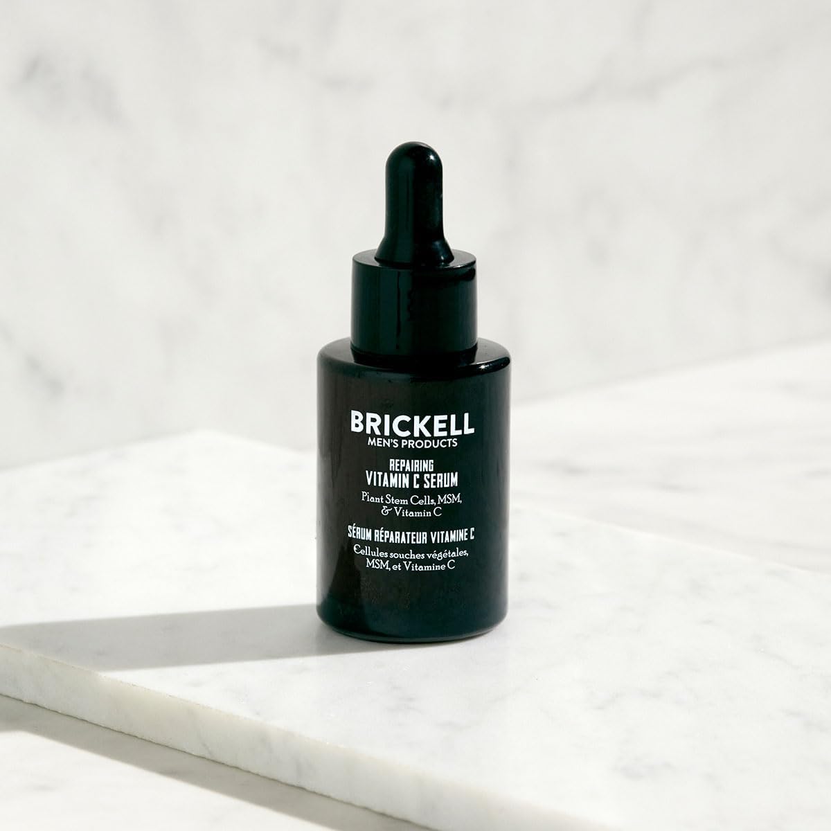 Brickell Men's plant stem cells serum bottle showcases advanced formula.