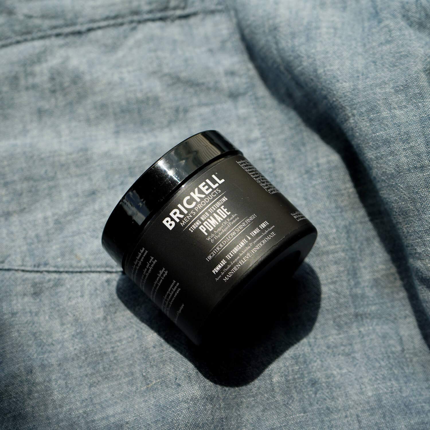 Brickell strong hold pomade 2oz tin demonstrates compact, travel-ready packaging