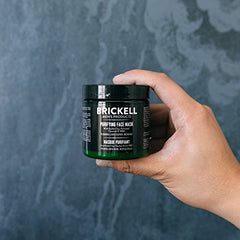 Applying Brickell mask on skin demonstrates detoxifying cleanse and oil balance