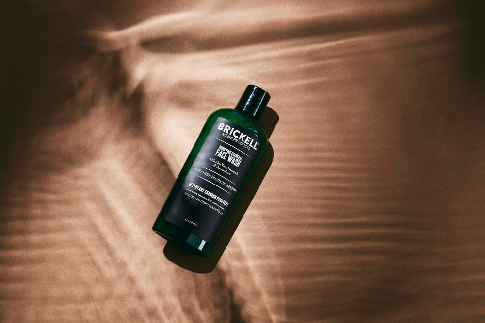 Brickell Men's Purifying Charcoal Face Wash foam close-up demonstrating gentle lather for sensitive skin