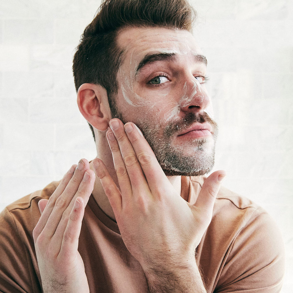 Brickell Men's Purifying Charcoal Face Wash ingredients close-up with charcoal and olive oil for deep cleansing