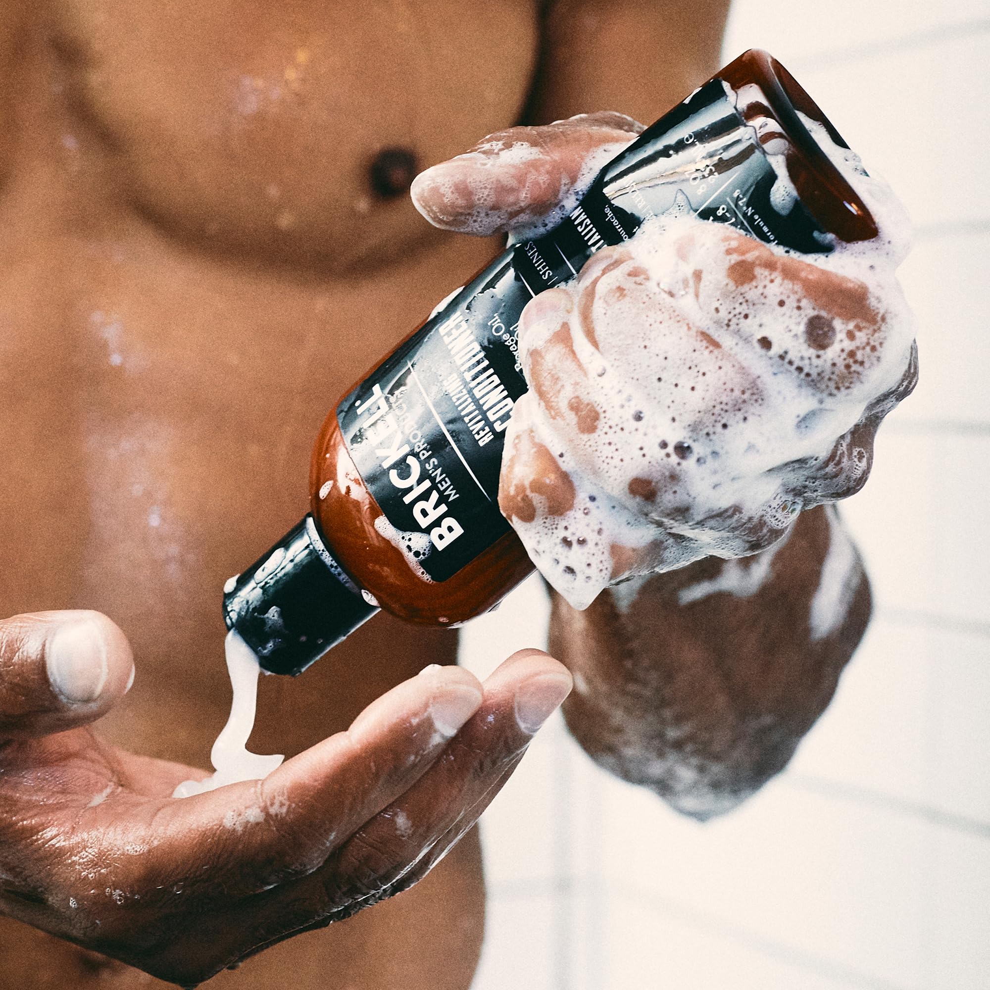 Brickell Men's Relieving Hair Care Set display on bathroom counter.