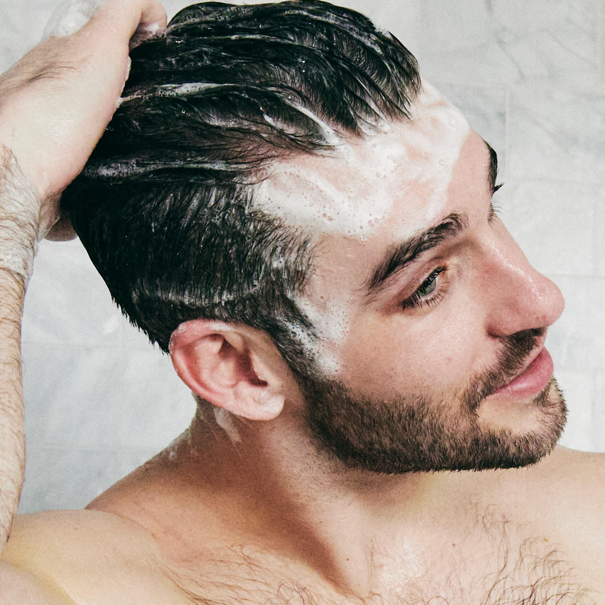 Brickell Men's Relieving scalp closeup emphasizing calm, flake-free look.