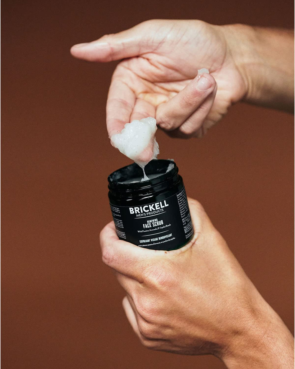 Brickell Renewing Face Scrub travel size fits gym bag for on-the-go exfoliation.