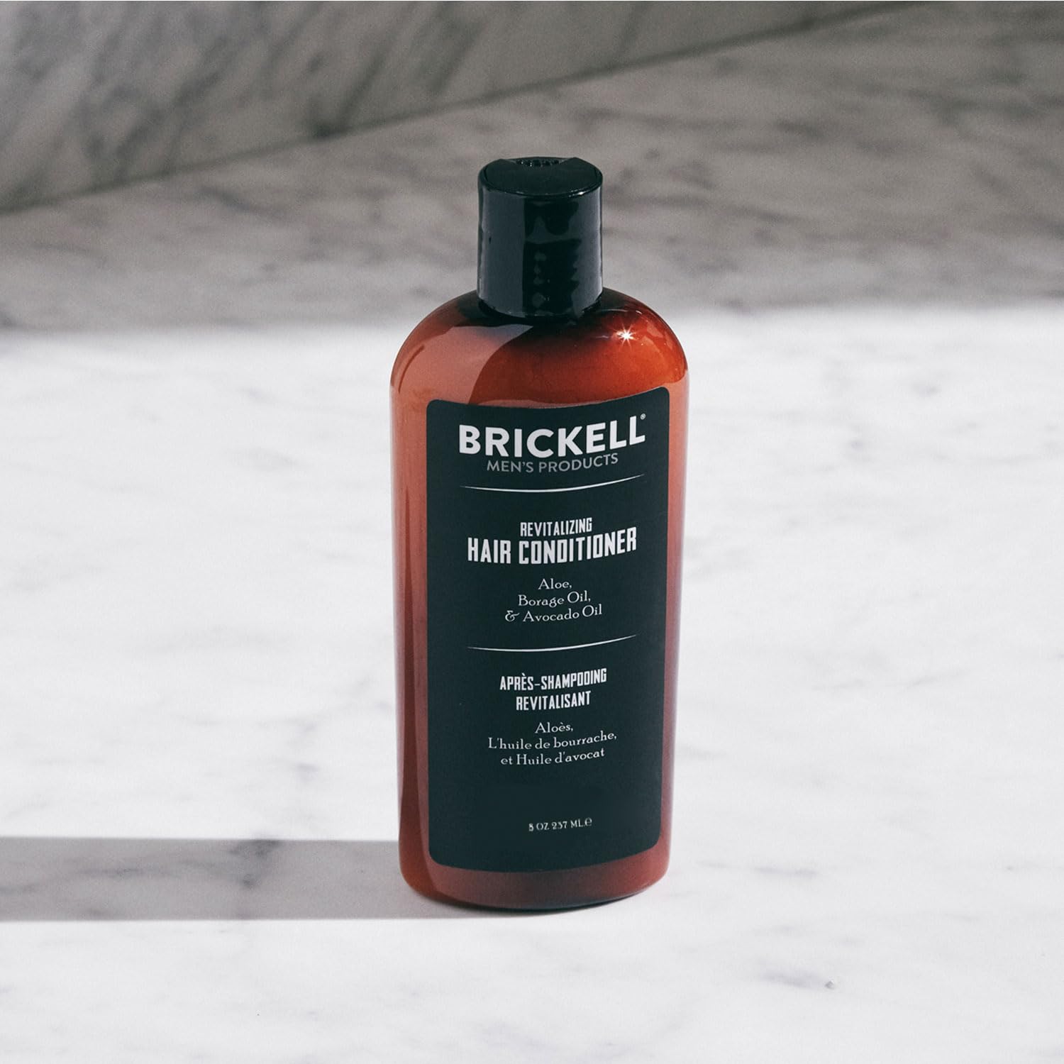 Brickell Men's Revitalizing Hair Conditioner pour highlights quick application and instant moisture.