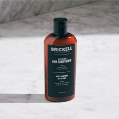 Brickell Men's Revitalizing Hair Conditioner pour highlights quick application and instant moisture.