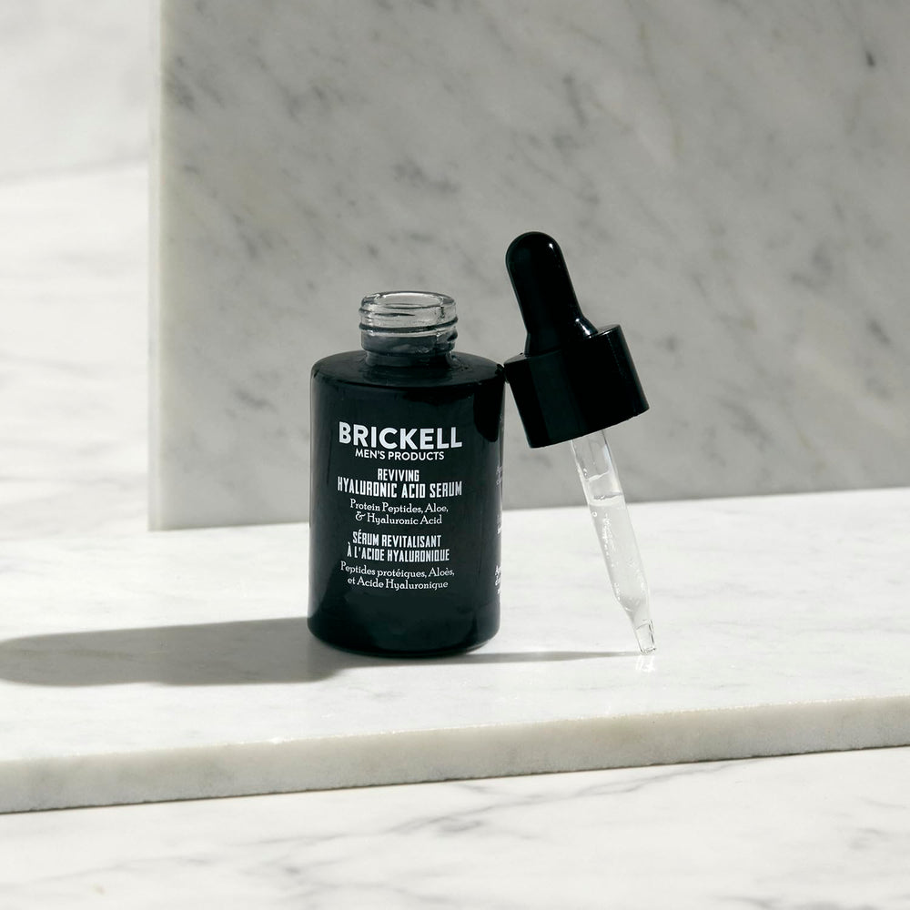 Brickell Men's serum application scene showing quick-absorbing hydration.
