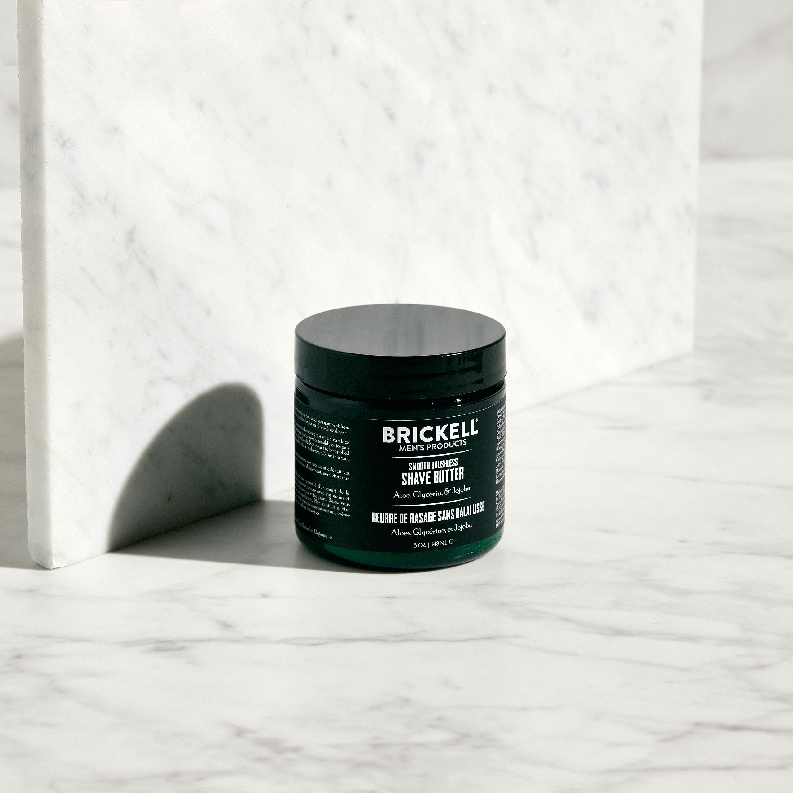 Brickell Smooth Brushless Shave Butter applied to skin to soften whiskers.