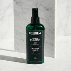 Brickell Men's Texturizing Sea Salt Spray mist on hair demonstrates lifted waves
