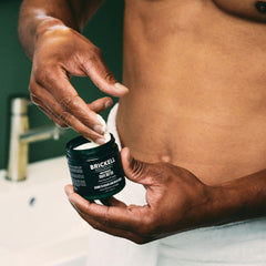 Close-up of Brickell shave butter texture showing creamy glide.