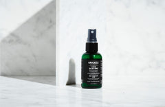 Brickell Texturizing Sea Salt Spray shows textured waves for beach-friendly styling.