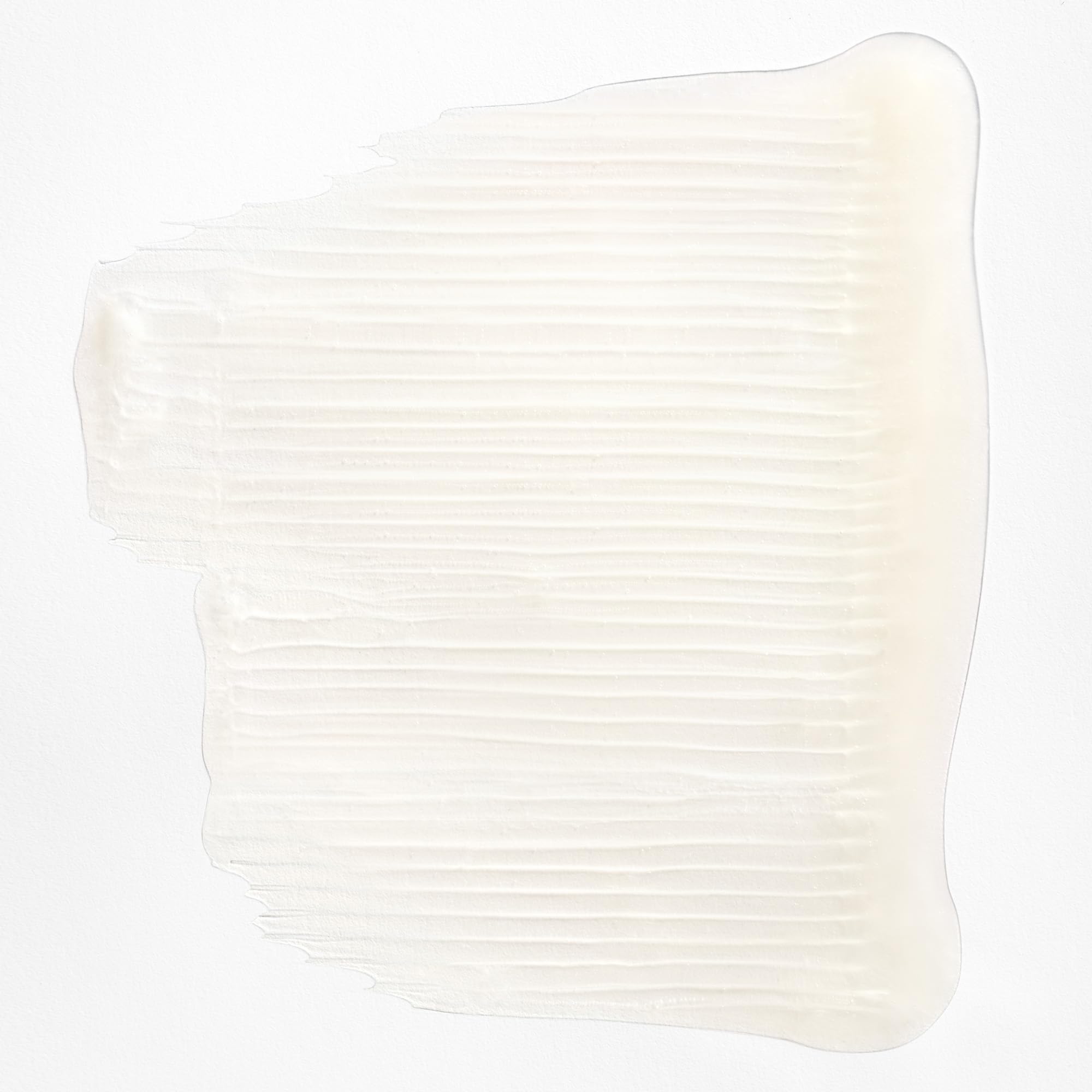 Briogeo Curl Charisma pump bottle dispensing shampoo lather for gentle cleanse of damp waves.