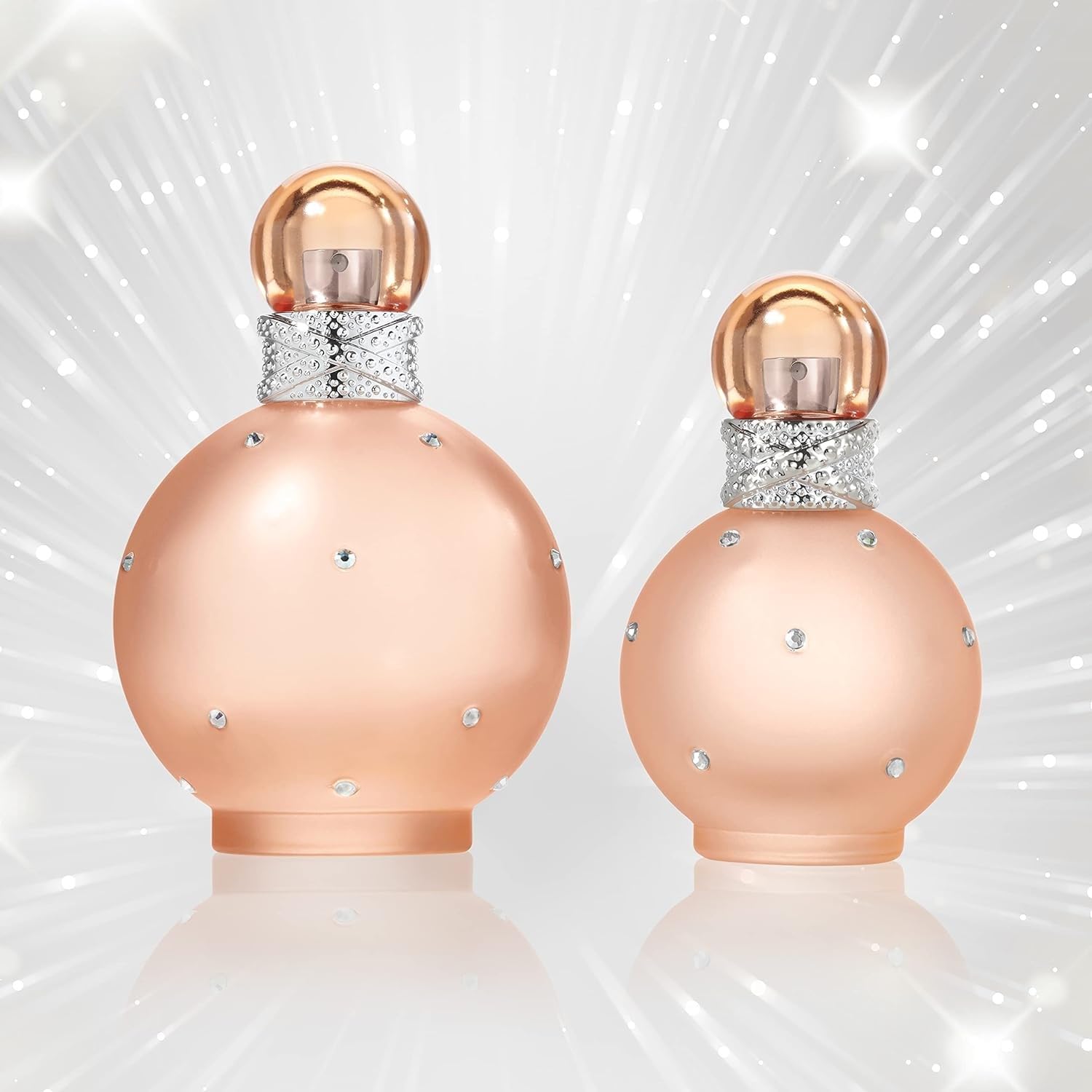 Britney Spears Naked Fantasy fragrance cap sparkle suggesting lingerie-inspired shimmer for night-out wear.