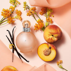 Britney Spears Naked Fantasy spray bottle in hand for easy daily application and confidence.