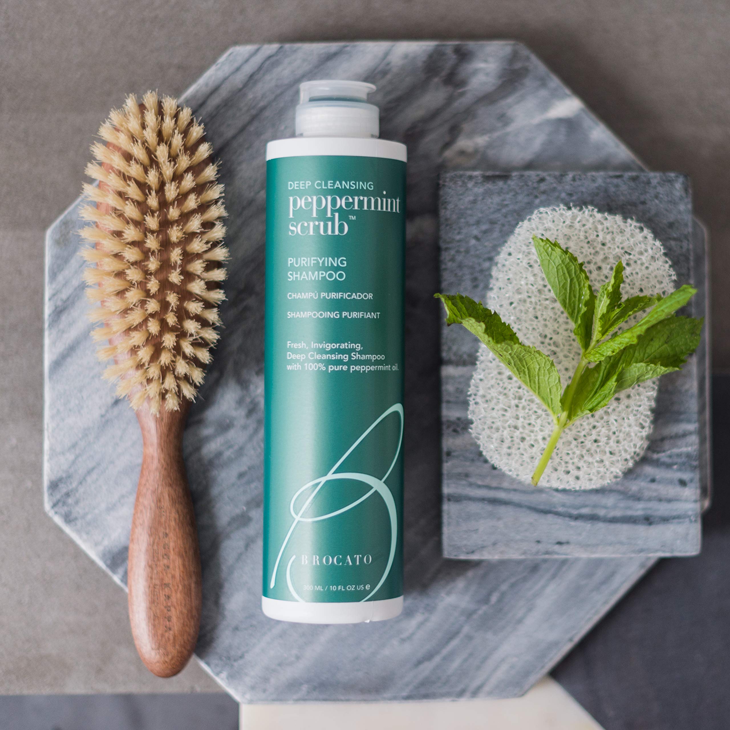 Brocato Peppermint Scrub Purifying Shampoo hands-massage shows cleansing reach and scalp refreshment.