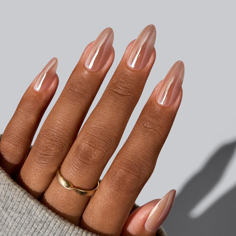 BTArtbox chocolate-glazed almond nails in motion with reflective surface.