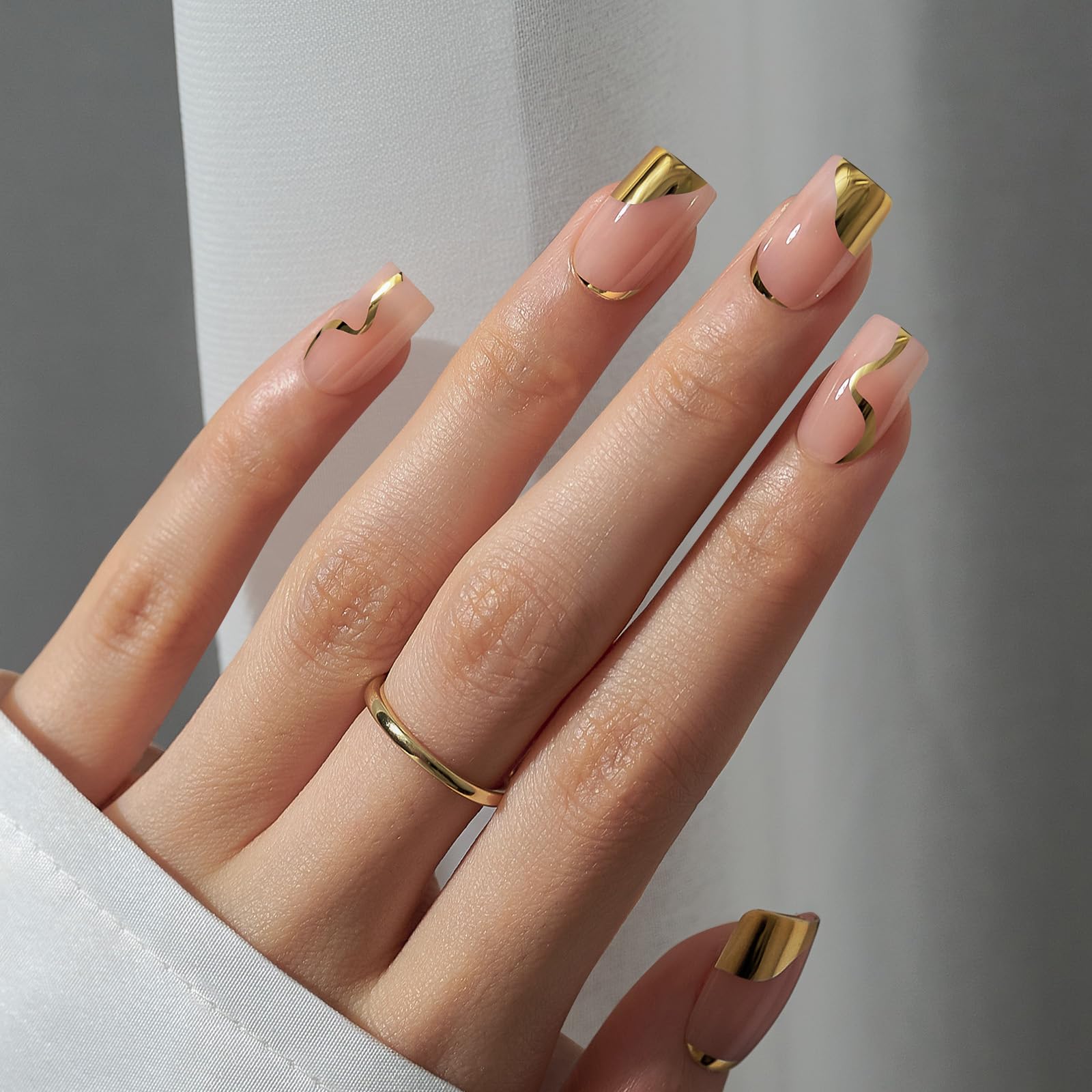 BTArtbox gold-tipped press-on nails kit demonstrates easy application