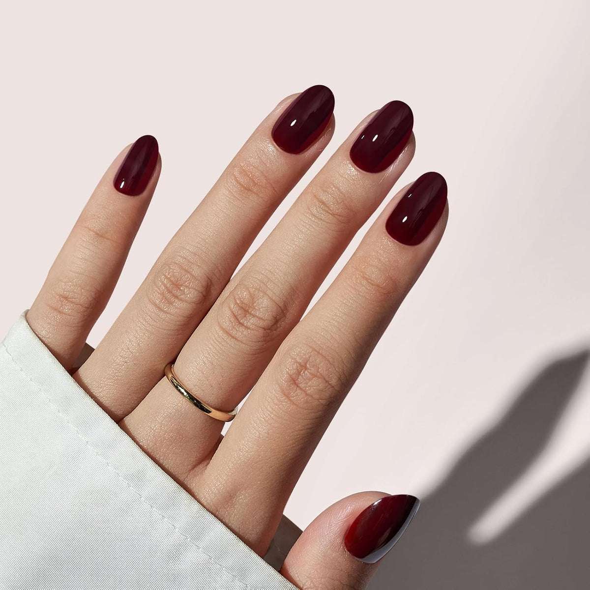 BTArtbox press on nails short dark red oval closeup with smooth gel finish.