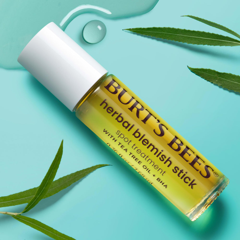 Burt's Bees Herbal Complexion Stick applied directly to a blemish.