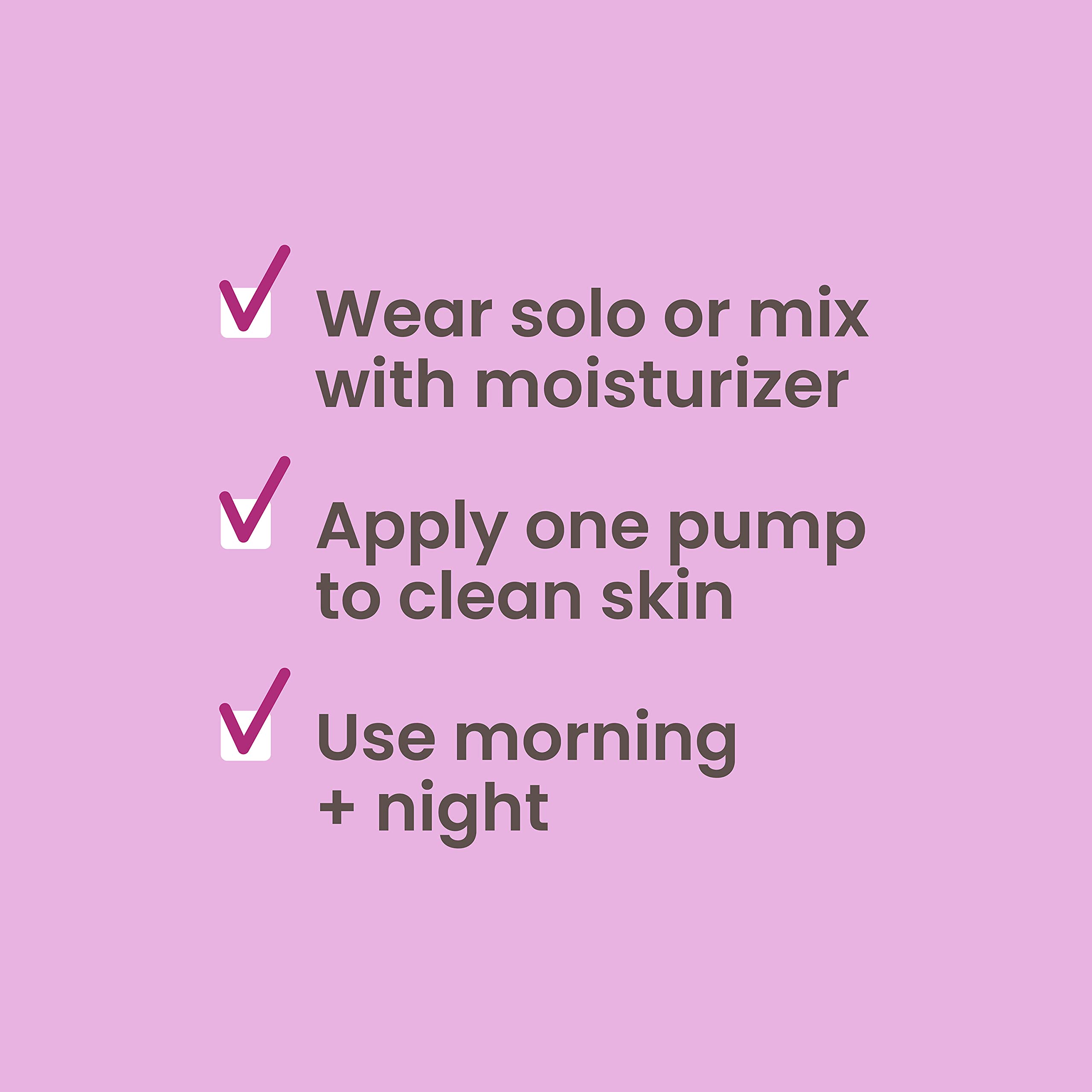 Burt's Bees firming serum on hand demonstrating easy application.