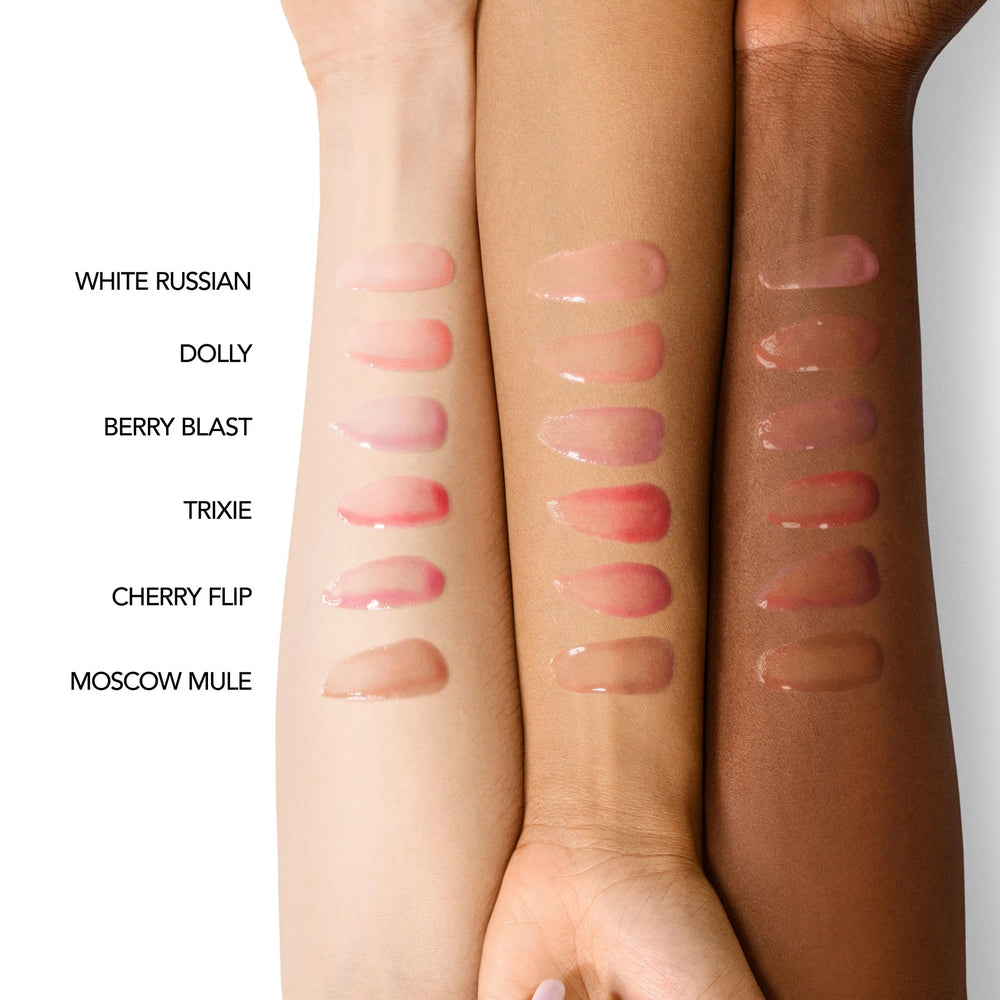 Close-up of Berry Blast gloss oil highlighting non-sticky, comfortable wear.