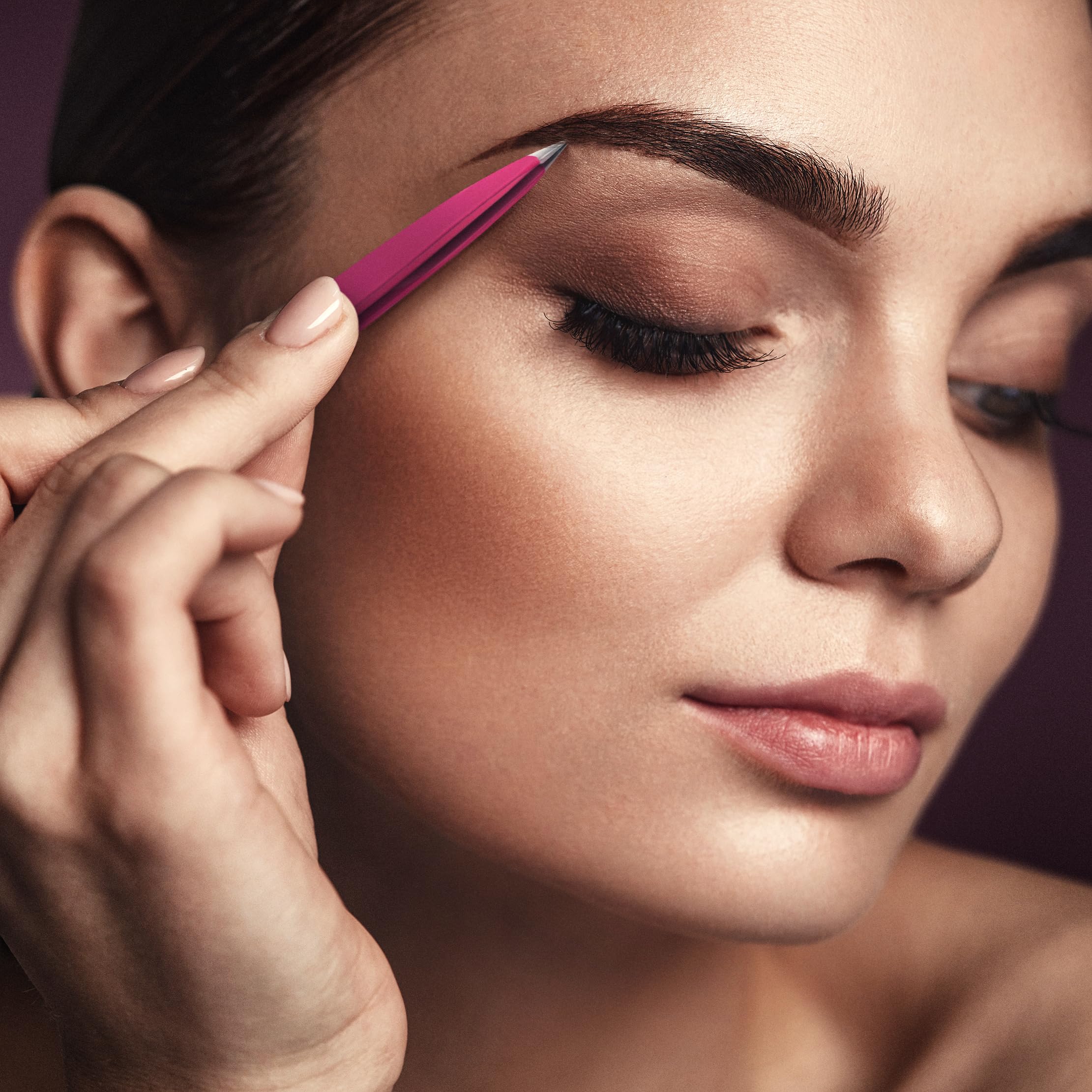 By MILLY pointed tweezers pink grip closeup shows ergonomic design.
