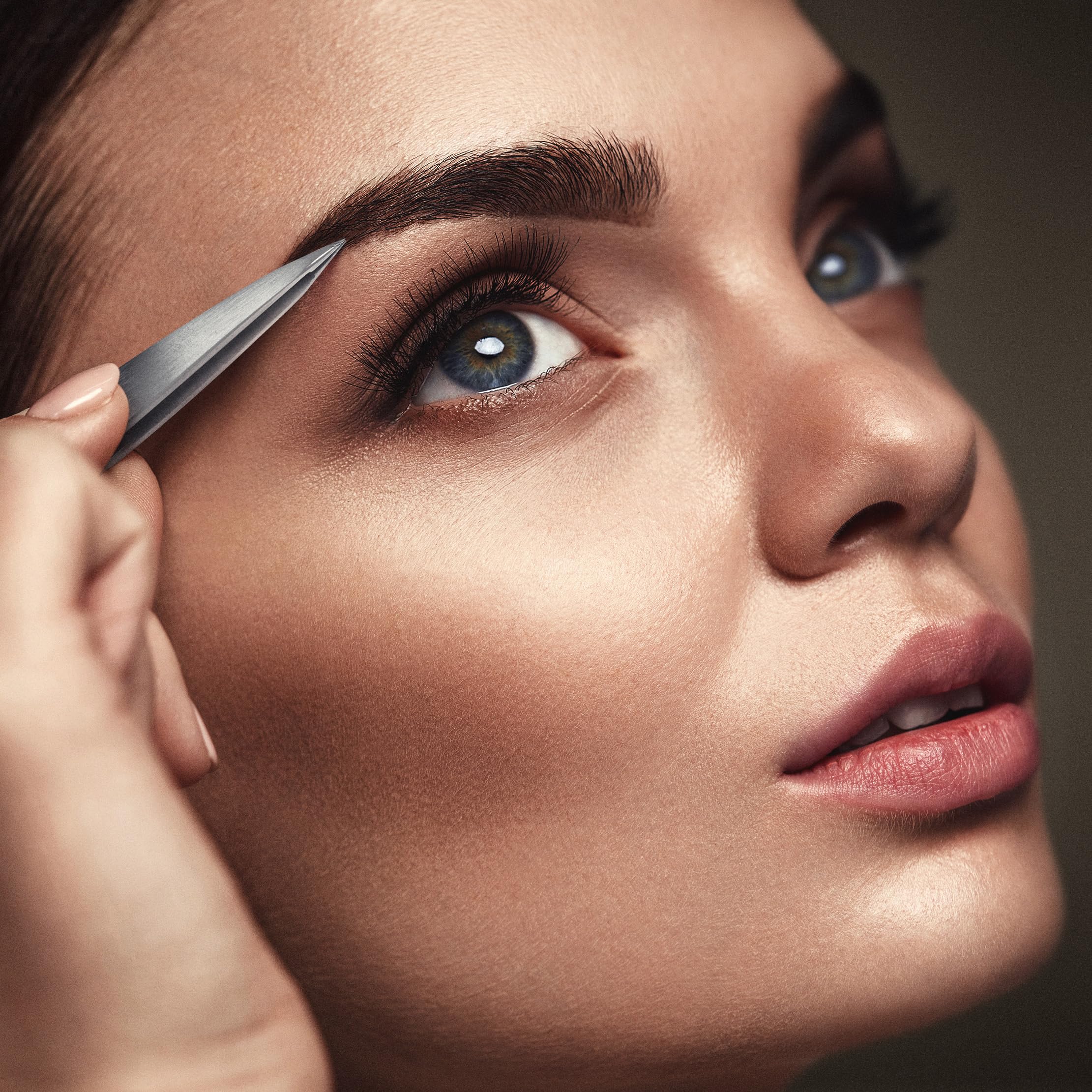 By MILLY precision tweezers in-use for eyebrow and facial hair grooming