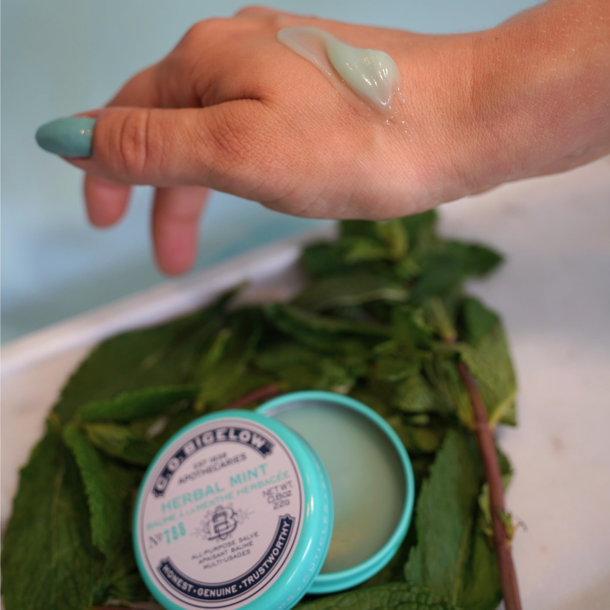C. O. Bigelow salve tins staged on vanity suggesting everyday skincare ritual