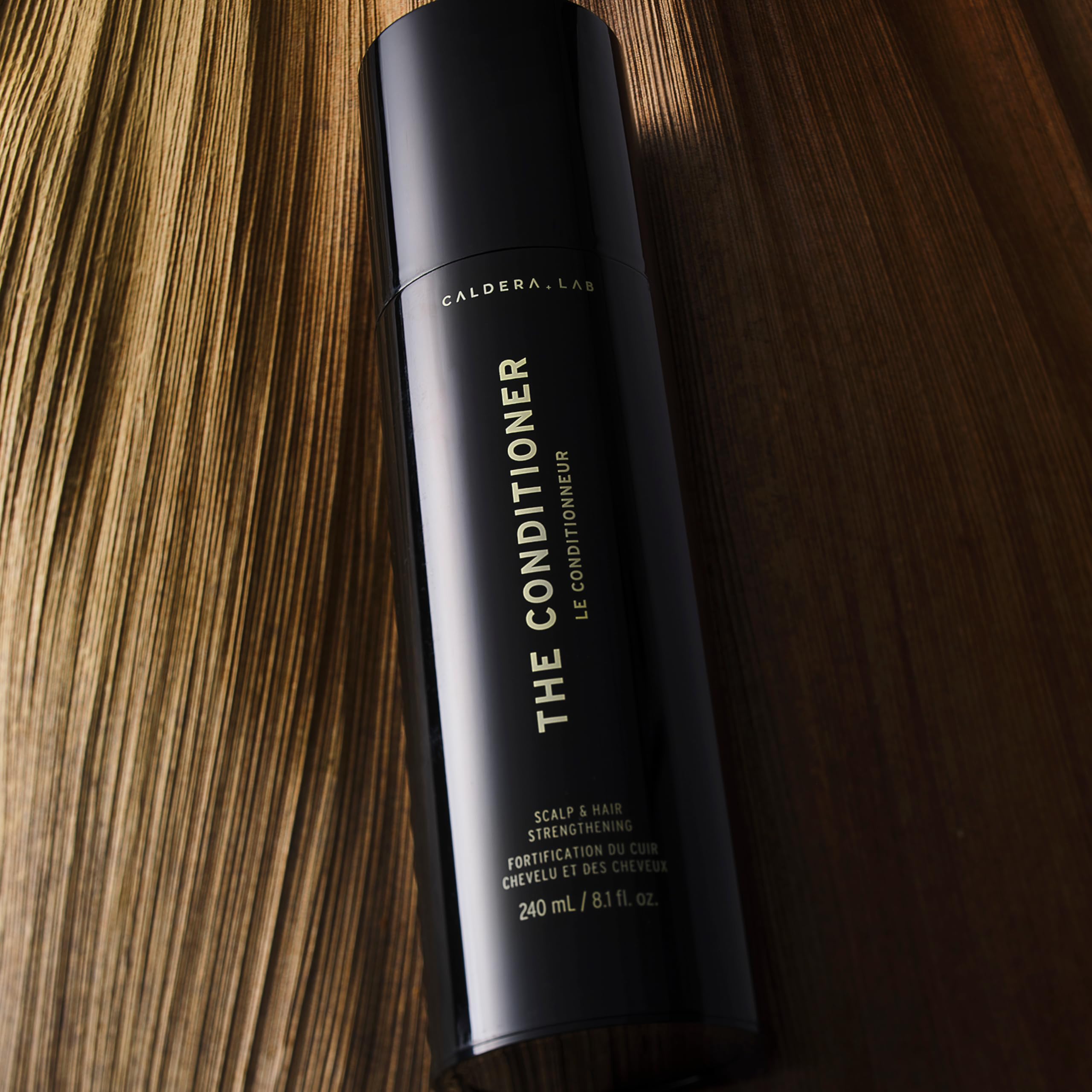 Caldera + Lab The Conditioner scalp-balance scene suggests healthier-looking hair through balanced care.