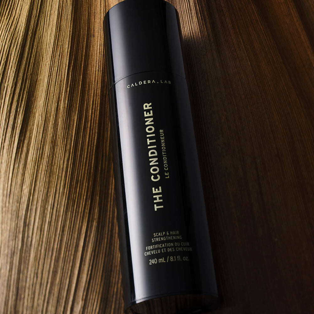 Caldera + Lab The Conditioner scalp-balance scene suggests healthier-looking hair through balanced care.