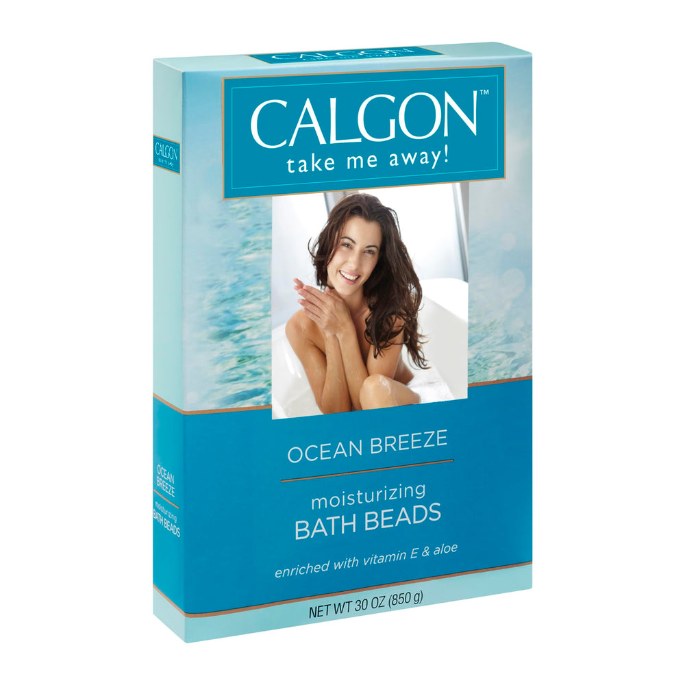 Calgon Ocean Breeze bottle and beads arranged for a refreshing bath experience.