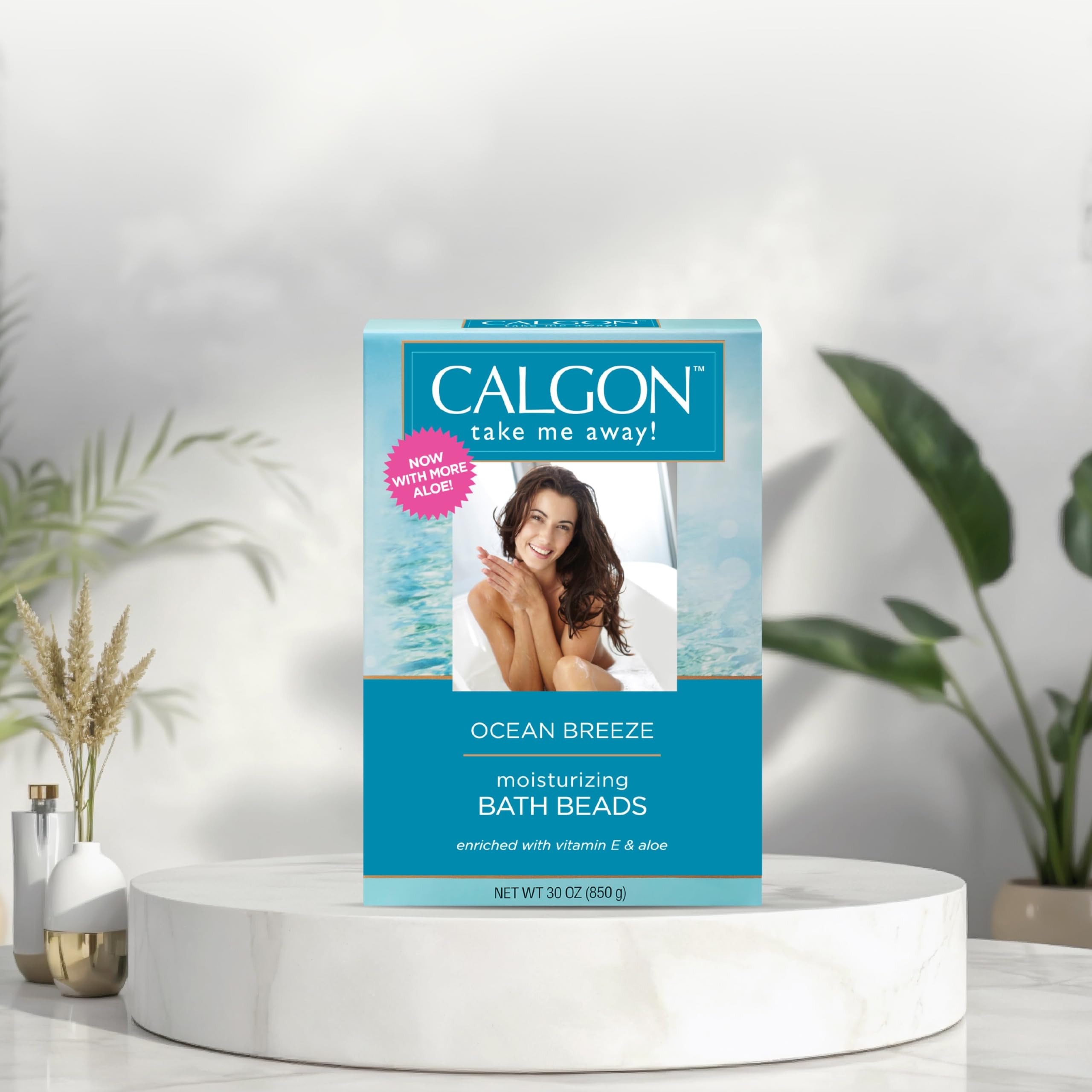 Calgon Ocean Breeze beads swirling in tub for spa-like aromatherapy.