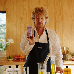 California Naturals Mens Re:GRO conditioner dispensed cream texture on hand for easy application.