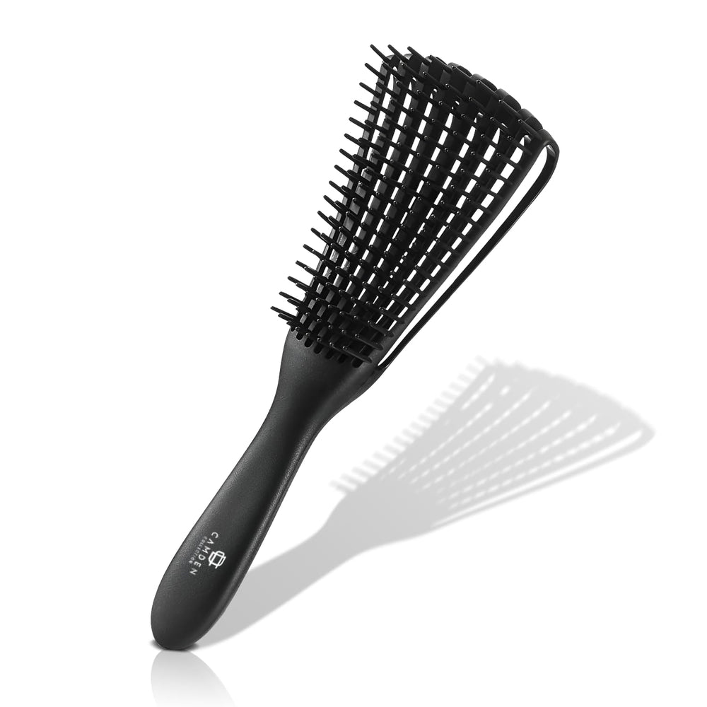 CamDen Premium Detangler Brush on wet hair for effortless detangling and smooth styling.