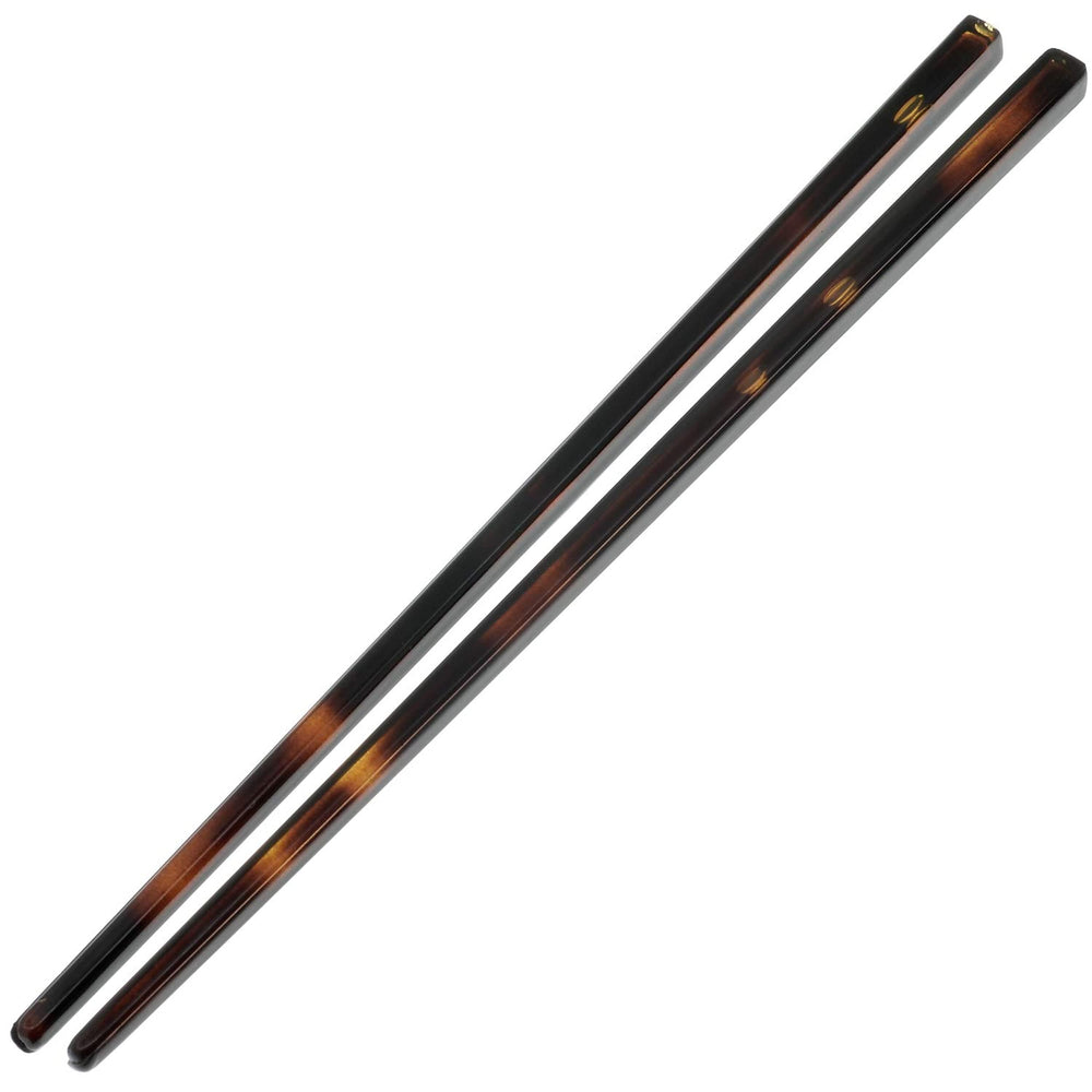 Camila Paris AD28/2 hair pin close-up in tortoise shell showing secure hold for updos.
