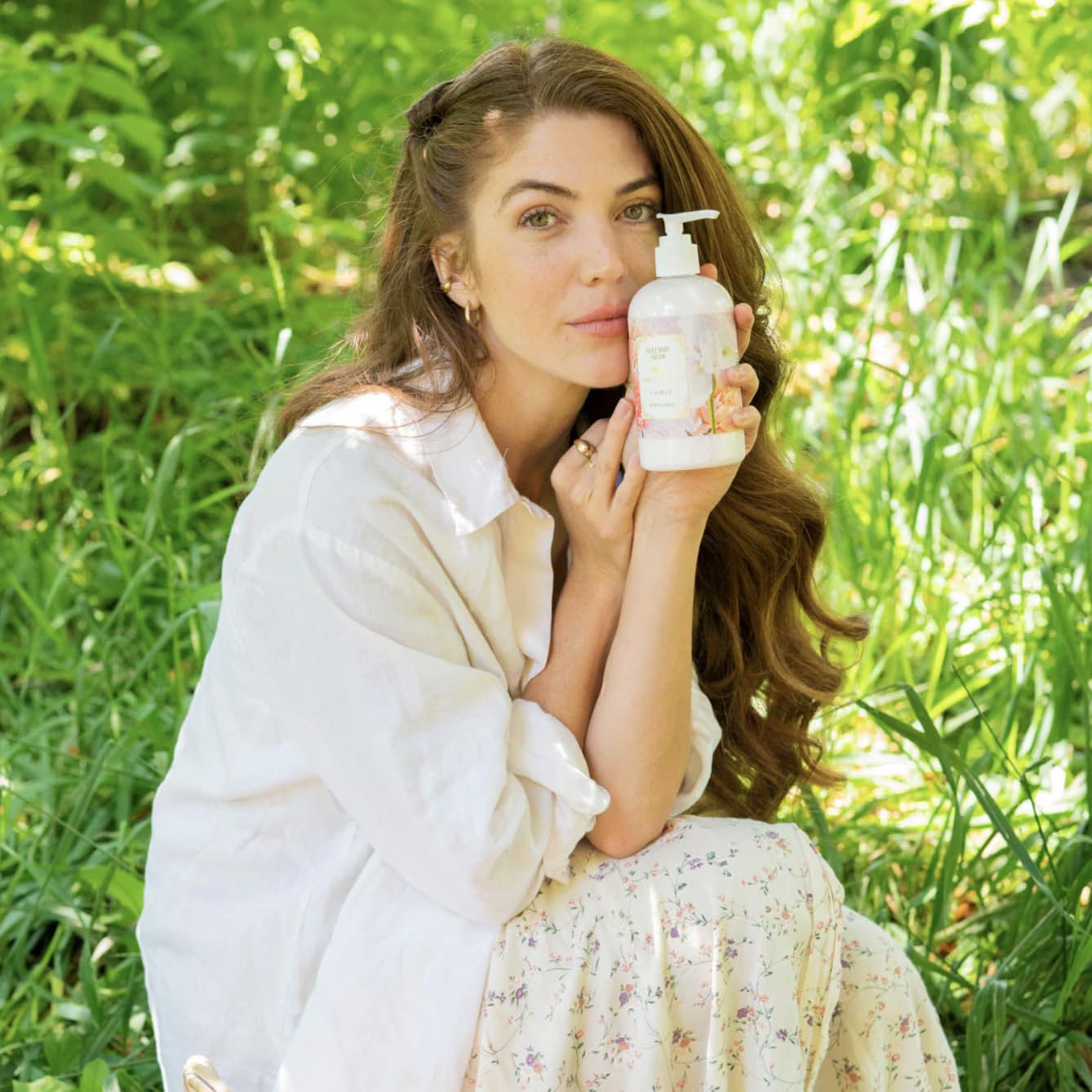 Camille Beckman Camille Scented Silky Body Cream floral-bouquet scent note in soft setting.