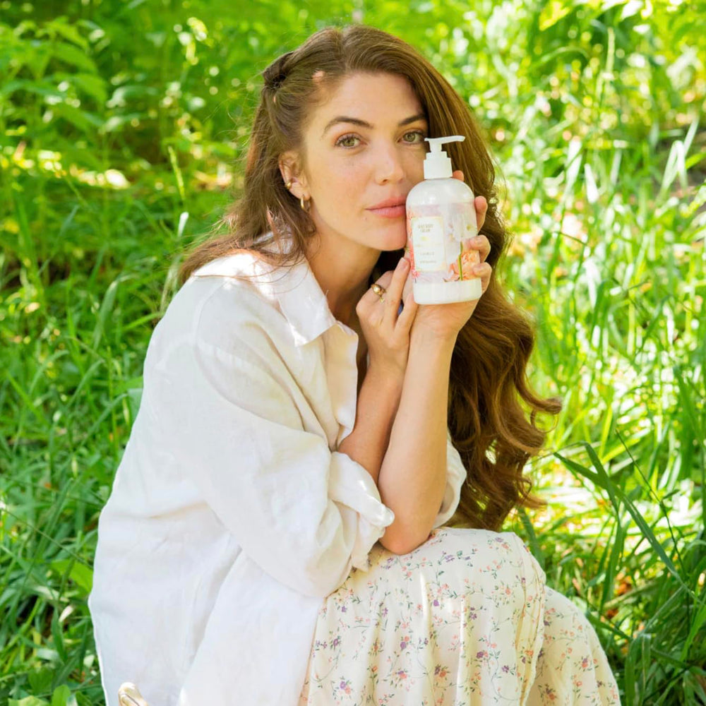 Camille Beckman Camille Scented Silky Body Cream floral-bouquet scent note in soft setting.