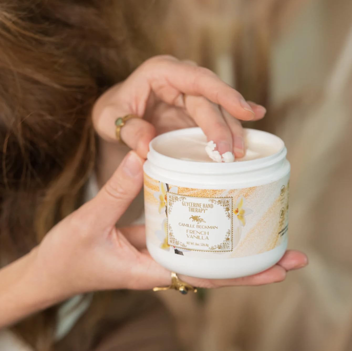 Camille Beckman hand cream being applied delivers instant moisture for soft skin.